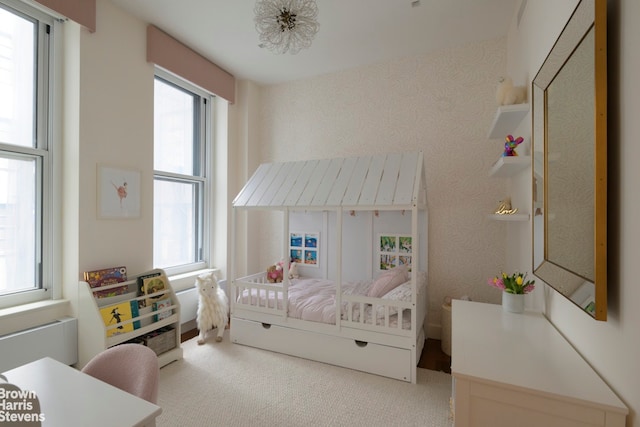 carpeted bedroom with wallpapered walls