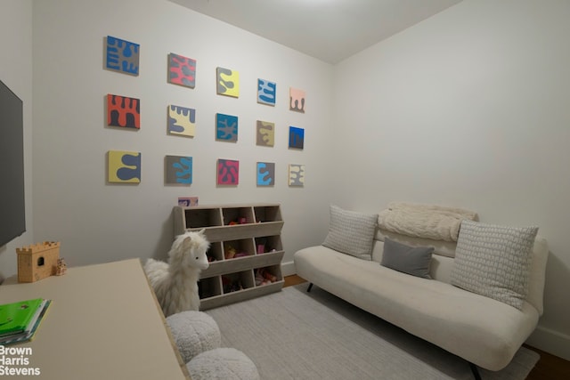 interior space featuring wood finished floors and baseboards