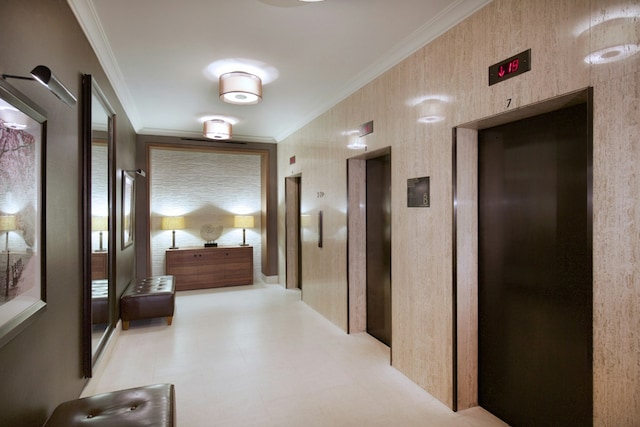 hallway featuring elevator, light floors, and ornamental molding