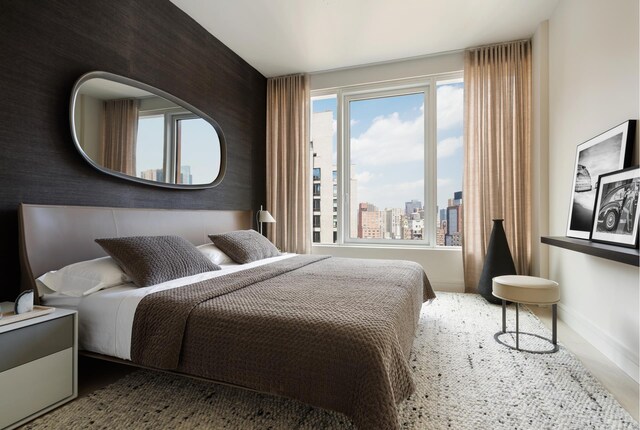 200 E 20th St Unit 2C, New York City, NY 10003 - bedroom with a view of city and baseboards