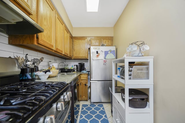 9729 4th Ave Unit 3-C, New York City, NY 11209 - kitchen with range with gas cooktop, under cabinet range hood, freestanding refrigerator, a sink, and backsplash
