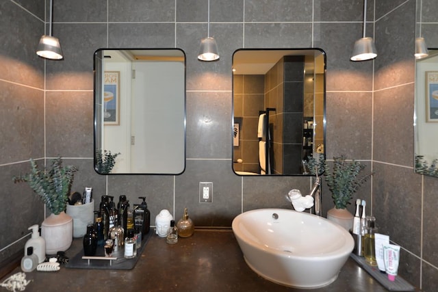 bathroom featuring tile walls and concrete floors