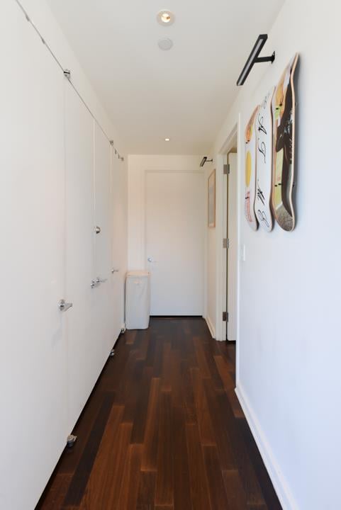 corridor with recessed lighting and wood finished floors