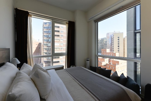 bedroom featuring a view of city