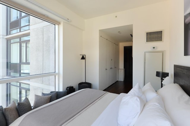 bedroom with multiple windows