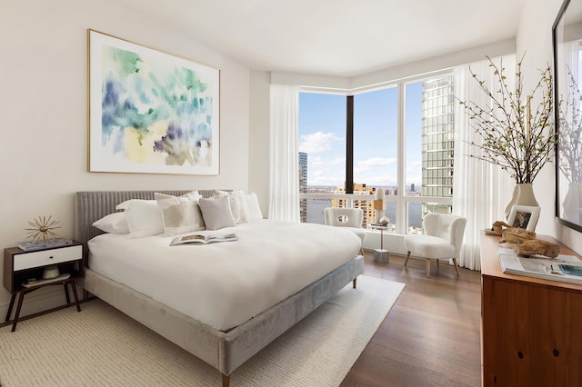 77 Greenwich St Unit 31-A, New York City, NY 10006 - bedroom with wood finished floors and a view of city