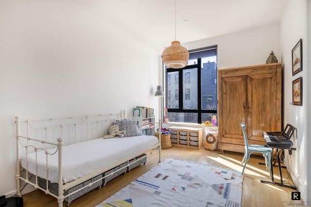 bedroom with wood finished floors