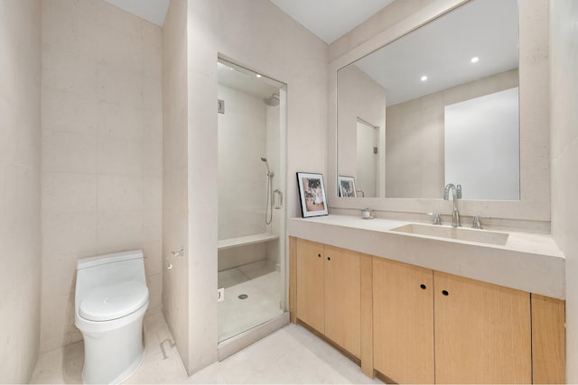 bathroom featuring vanity, a stall shower, and toilet