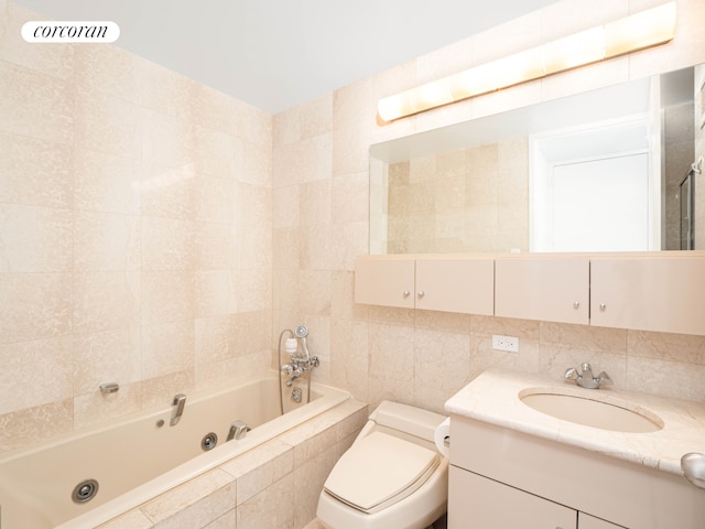 full bath featuring vanity, toilet, a whirlpool tub, tile walls, and tiled shower