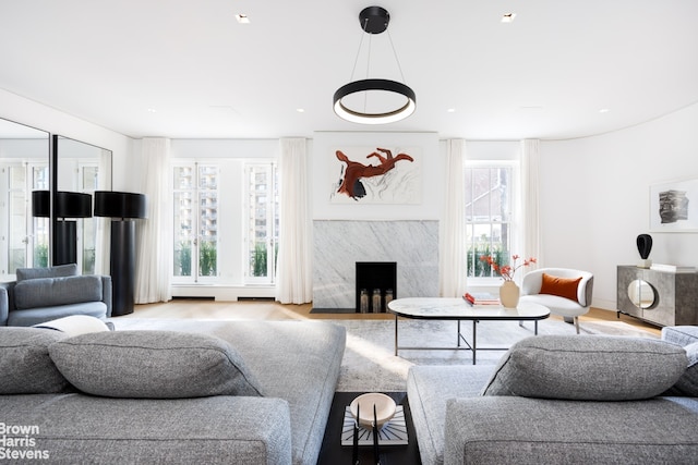 171 W 71st St Unit 9/10A, New York City, NY 10023 - living area with wood finished floors and a high end fireplace