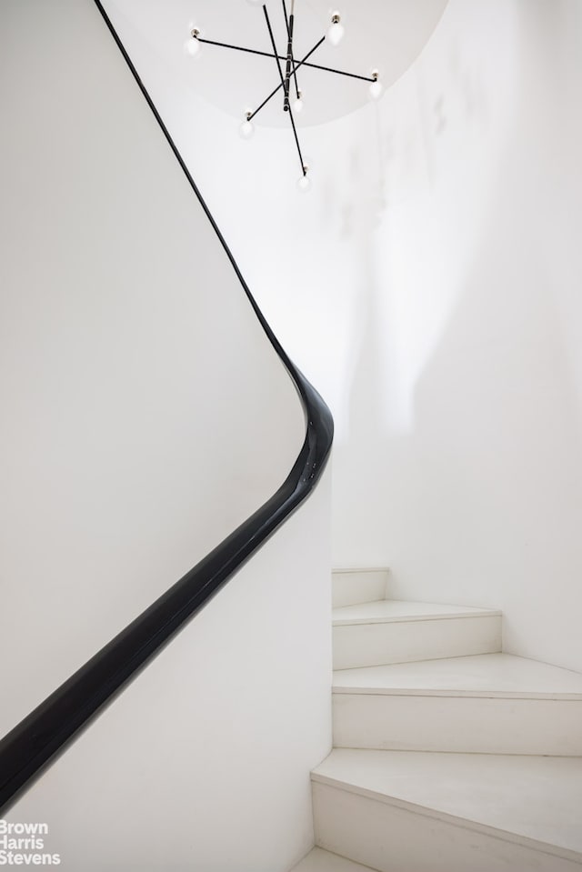 171 W 71st St Unit 9/10A, New York City, NY 10023 - staircase with a chandelier