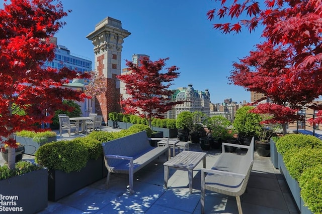 view of patio with a city view and an outdoor hangout area