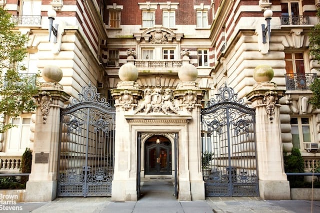 view of gate with a fenced front yard