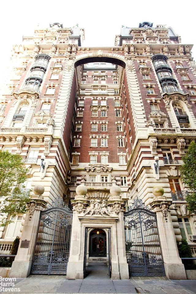 view of building exterior featuring a fenced front yard