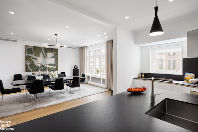 dining area with recessed lighting, visible vents, and wood finished floors