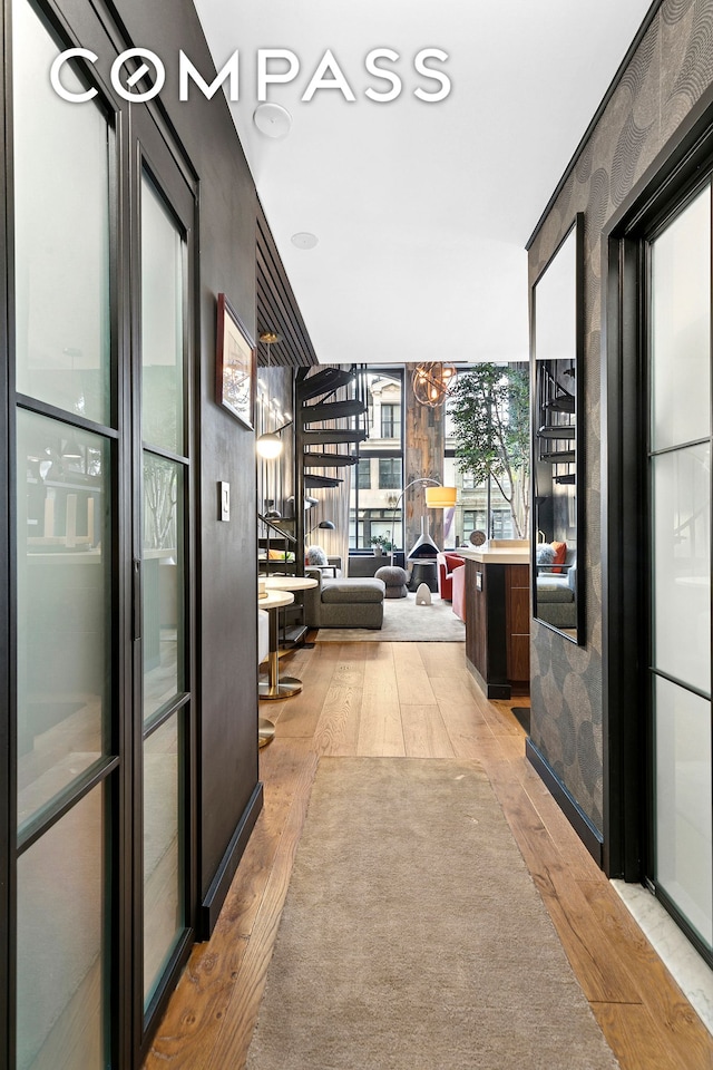 interior space with expansive windows and light wood finished floors