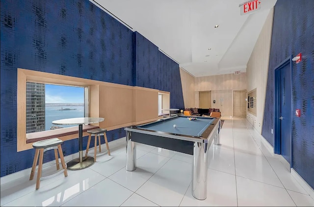 playroom with billiards, light tile patterned floors, baseboards, wallpapered walls, and a high ceiling