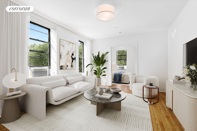 living room with a healthy amount of sunlight and light wood-type flooring