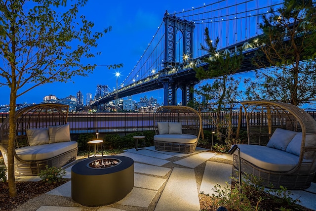 view of patio featuring a city view and fence