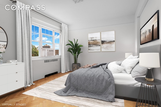 bedroom featuring radiator heating unit