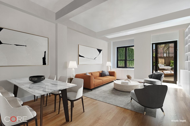 living room with beam ceiling and light wood-style floors