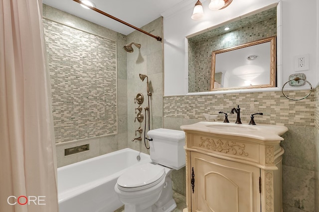 full bathroom featuring shower / bath combo with shower curtain, toilet, tile walls, and vanity