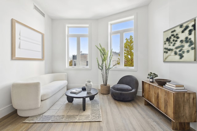 living area featuring wood finished floors and baseboards