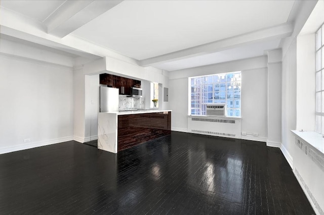 unfurnished living room featuring beam ceiling, radiator, baseboards, and dark wood-style flooring