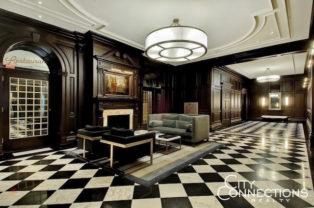 common area featuring crown molding, a decorative wall, and recessed lighting