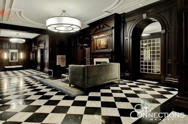 common area featuring ornamental molding and a decorative wall