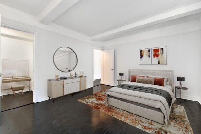 bedroom featuring beam ceiling, wood finished floors, and baseboards