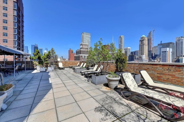 view of patio with a skyline view