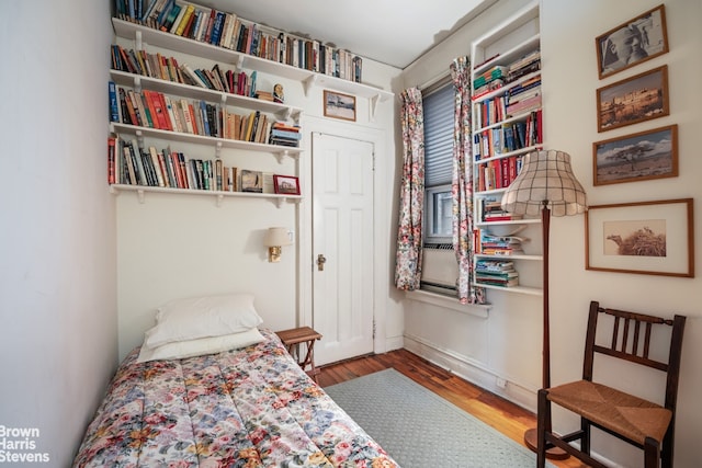 bedroom featuring wood finished floors