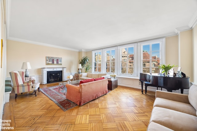 living area with a fireplace and ornamental molding