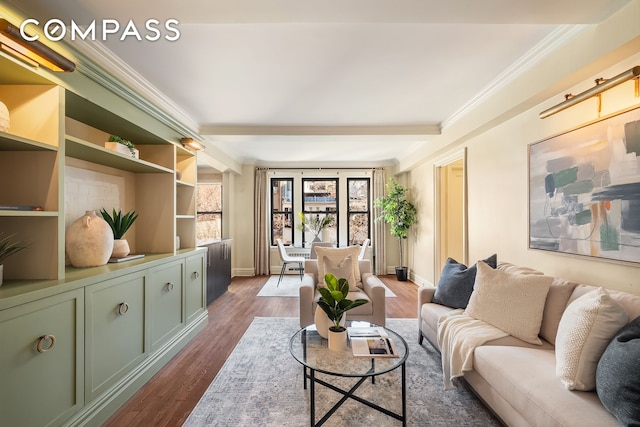 living area with ornamental molding, dark wood-style floors, and baseboards