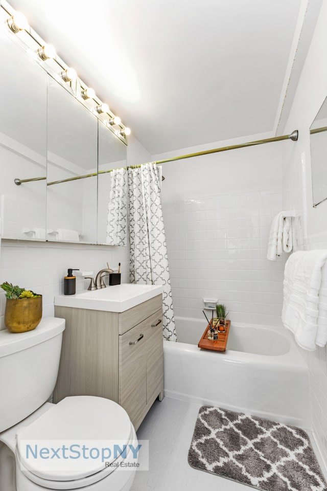 full bathroom with vanity, tile patterned floors, toilet, and shower / bath combo with shower curtain