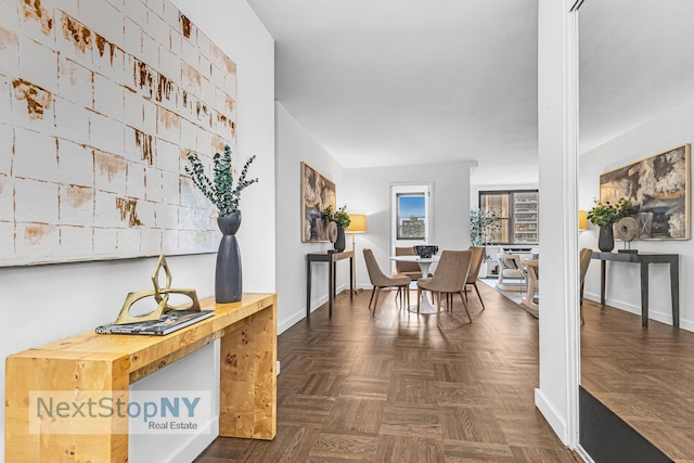 interior space featuring baseboards