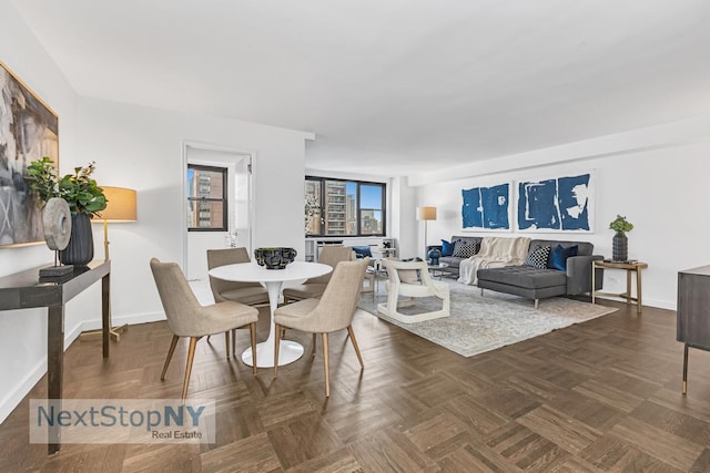 dining area featuring baseboards