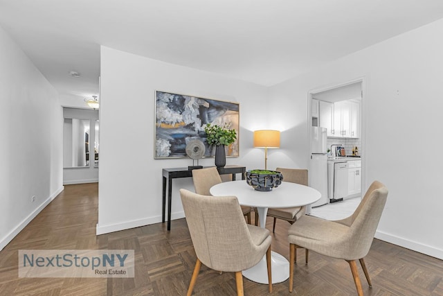 dining space with baseboards