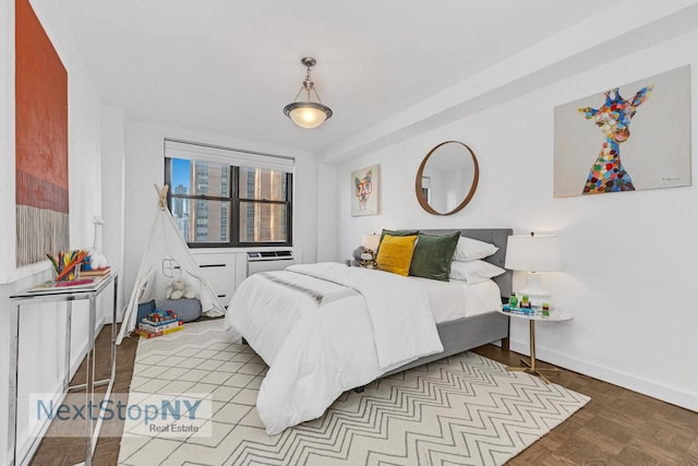 bedroom featuring baseboards