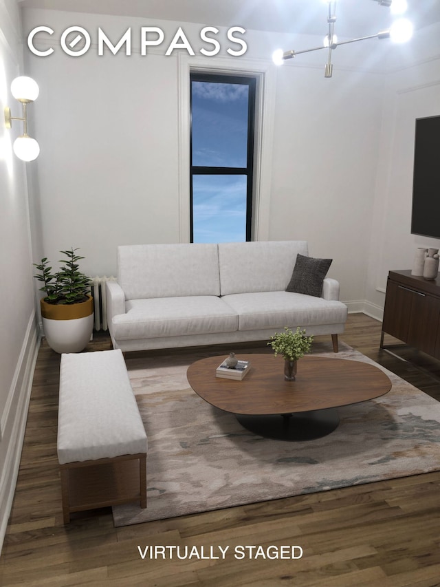 living room featuring baseboards and wood finished floors