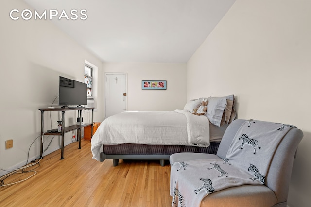 bedroom with wood finished floors