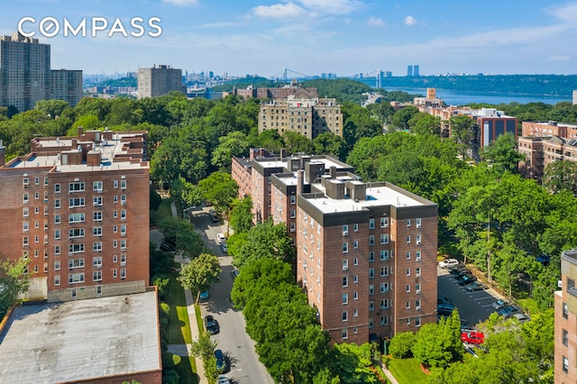 aerial view featuring a view of city and a water view