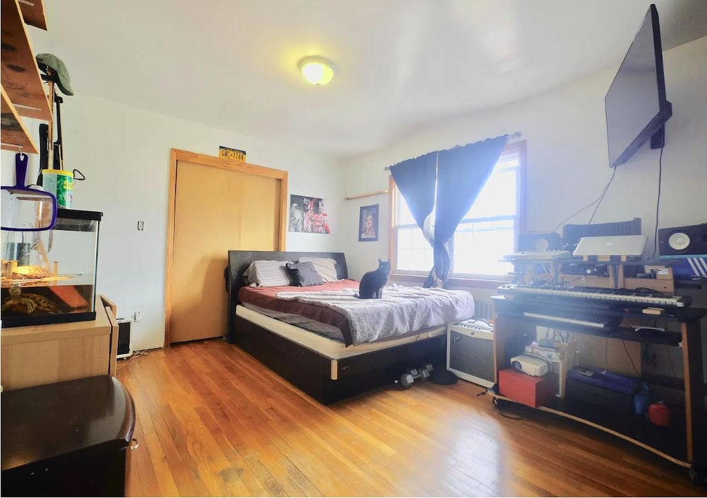 bedroom featuring wood finished floors