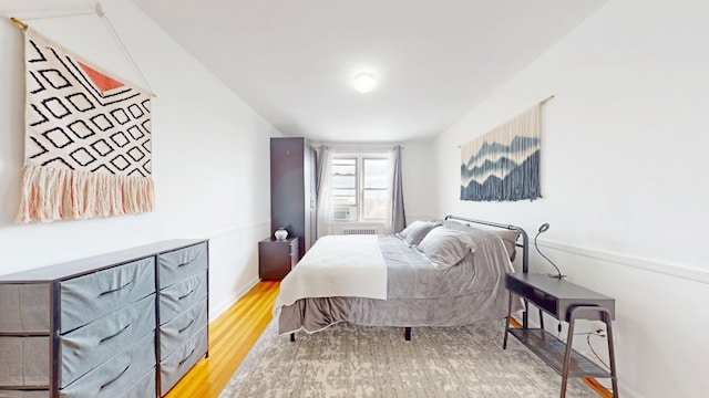 bedroom with wood finished floors
