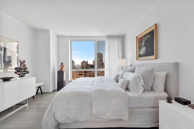 bedroom with wood finished floors