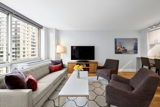 living room with light wood-style floors and baseboards