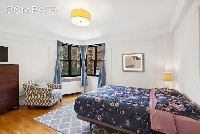 bedroom featuring wood finished floors