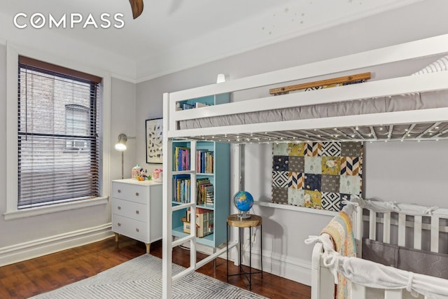 bedroom featuring wood finished floors