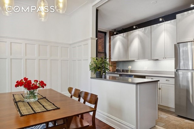 dining room with a decorative wall